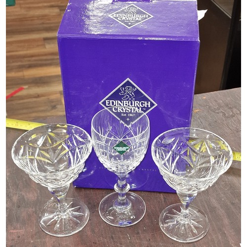 112 - Boxed and unused Edinburgh Crystal pair of wine glasses and unboxed pair of champagne saucers