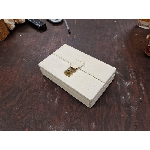 76 - Vintage cream jewellery case and contents