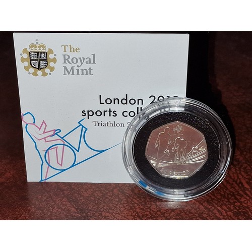 166 - Royal Mint limited edition 2012 Olympics, 925 silver triathlon 50p coin in case with COA