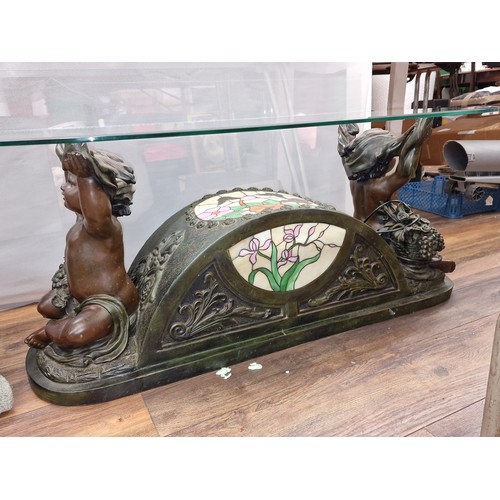 4 - 120 x 60 x 48 cm glass top coffee table. Bronze look cherub supports and light up tiffany style stai... 