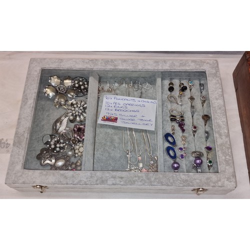 110 - Plush counter top jewellery display case containing assorted 925 silver and silver tone necklaces, r... 