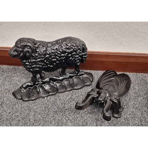 232 - Enamelled cast iron insect boot jack and sheep door stop