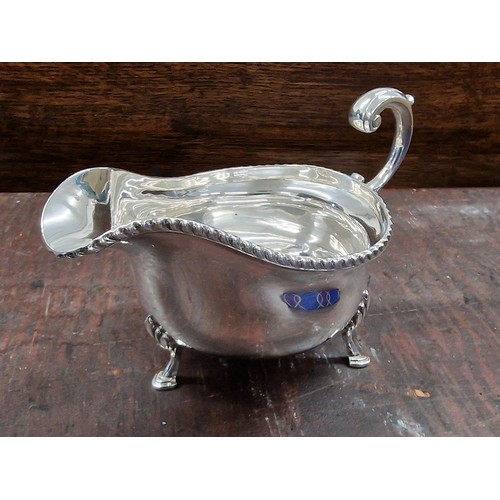 266 - 1937 Elkington & Co Birmingham clean silver gravy boat on 3 legs - 232.8 gm.