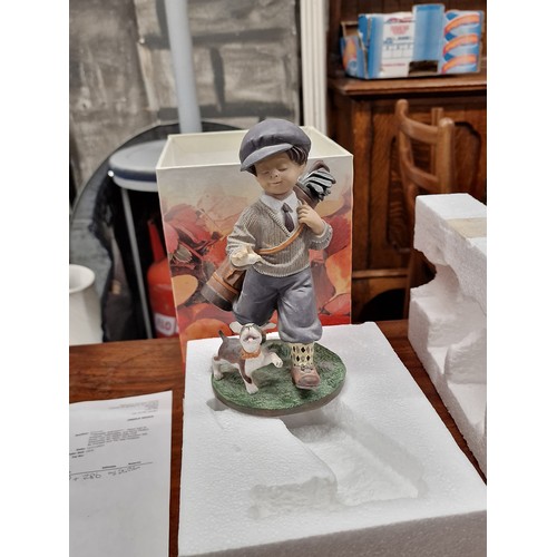 149 - Boxed and mint Nadal Studio Spain limited edition boy golfer and dog figure titled playing around