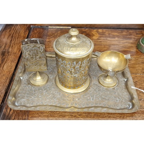 43 - Engraved pattern brass 4-piece smokers set being ashtray, cigarette case and match box holder on tra... 