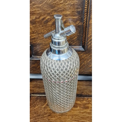 76 - Vintage Sparklets white metal lattice weave encased soda syphon