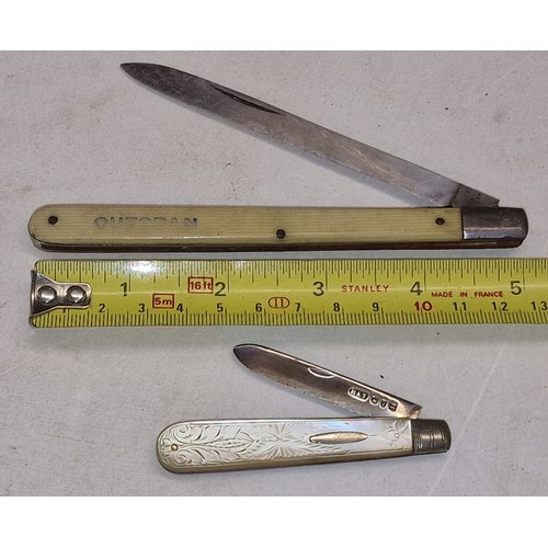185 - 1 x hallmarked silver and mother of pearl and one x other Outspan brand fruit knives
