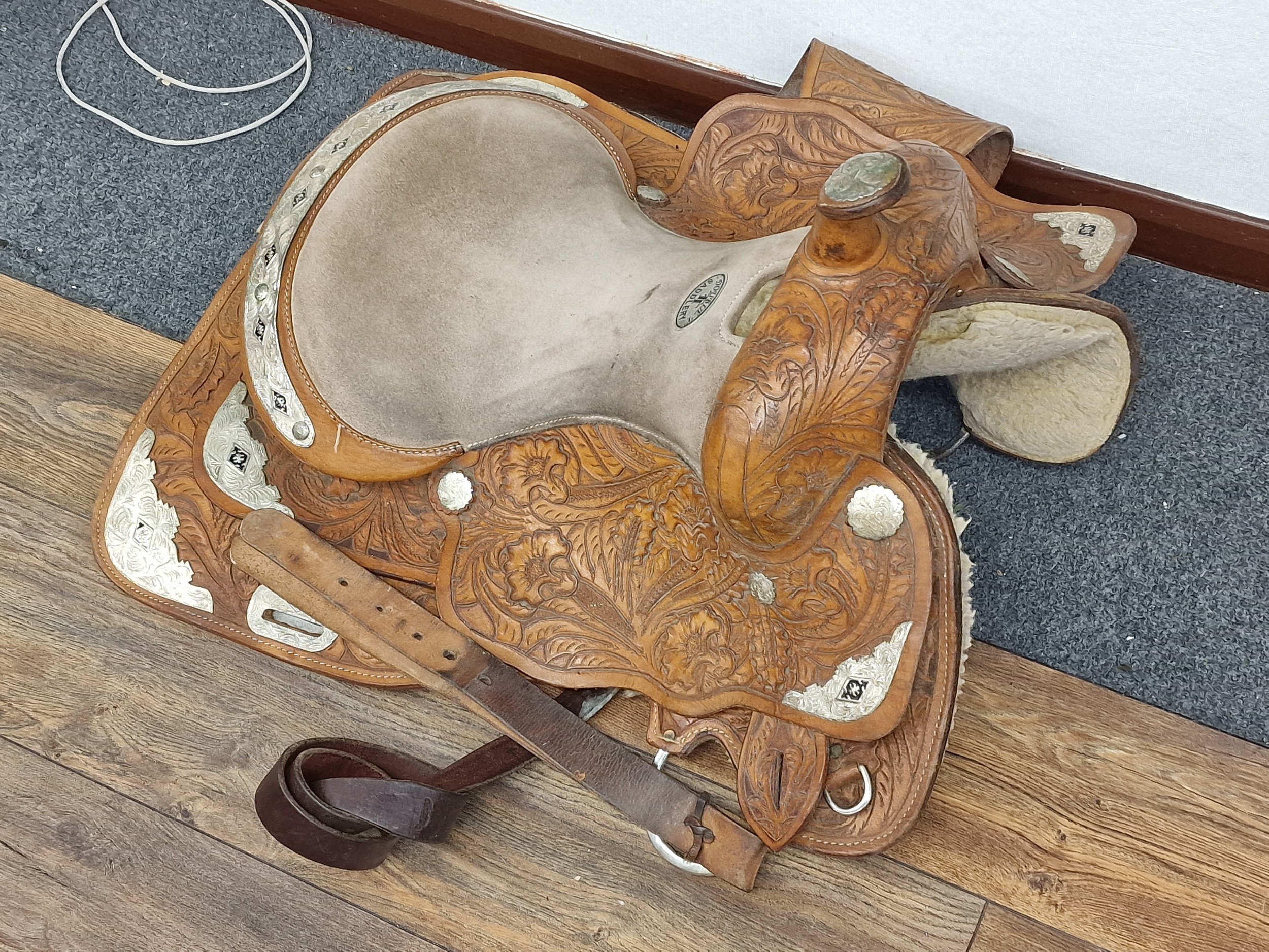 Double T Saddlery tan leather saddle, all proceeds from this lot go to 