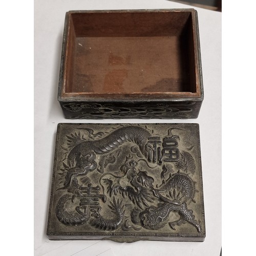 63 - Bronze Chinese cigarette box with wooden lined inner and raised dragon patterning