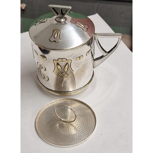 64 - Vintage WMF art nouveau silver plate and gilt detail cup with strainer