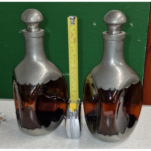 212 - Pair of Royal Holland Pewter and amber glass, 3-sided decanters