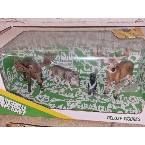 241 - New and boxed Animal Planet Deluxe North American animals being wolf, moose and stag and skunk