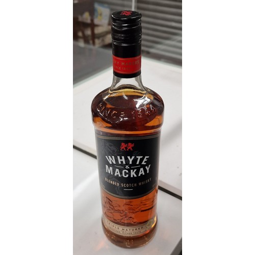 3 - Unopened 1 litre bottle of Whyte and Mackay triple matured blended Scotch whiskey.