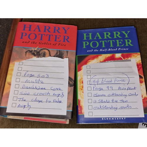 11 - 2 x Harry Potter first edition books with noted spelling mistakes.