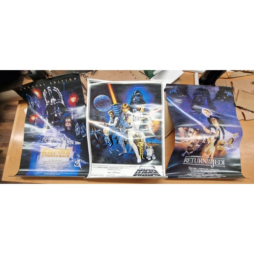 56 - Approximately 43 x 61 cm trio of Star Wars film posters on gloss paper being Star Wars, Return of th... 