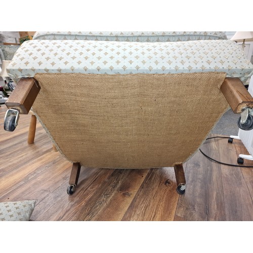 134 - Vintage shell back armchair with arm cushion