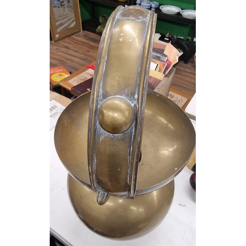 229 - 2 ft tall brass Indian holy water carrier