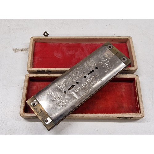 320 - Hohner 'The up to date' twin harmonica in original distressed box - back plate loose