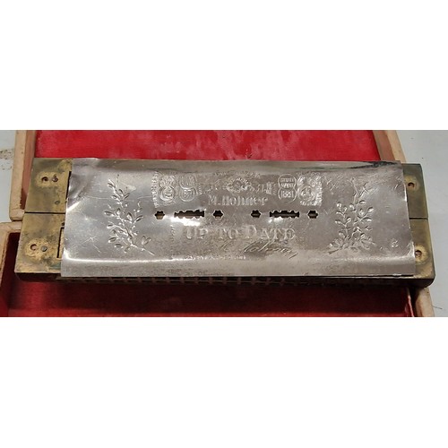 320 - Hohner 'The up to date' twin harmonica in original distressed box - back plate loose