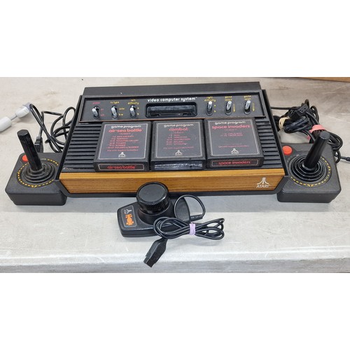 95 - Vintage Atari with controllers and 3 x games but no power lead - believed working but offered as spa... 