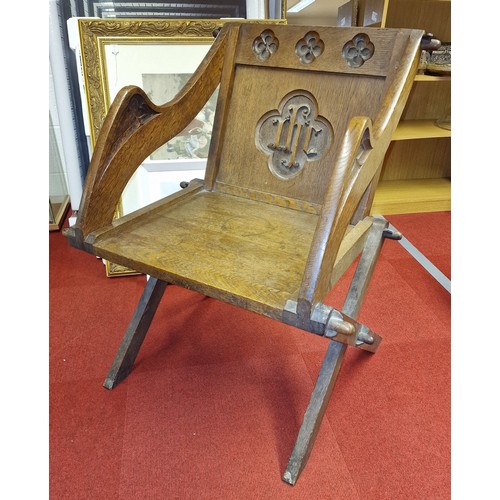 281 - 19th century Gothic revival oak Glastonbury chair with initialled back