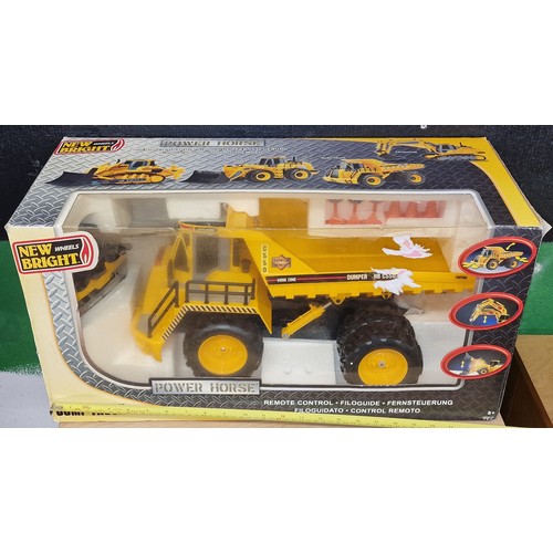 148 - Boxed as new Power Horse large scale remote control dumper truck and Remco Tuff Ones toy model dumpe... 