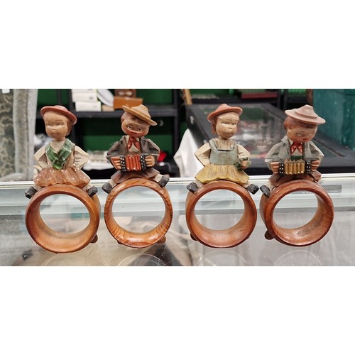 91 - Set of 4 x ANRI hand carved Black Forest napkin rings with bobble head characters