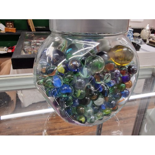 366 - Storage jar with assorted size and style glass marbles