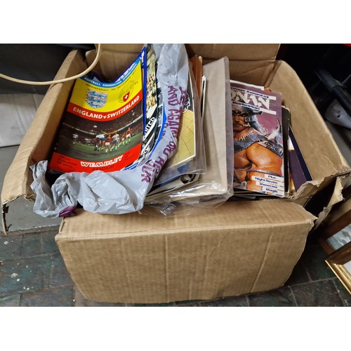 31 - Large box of assorted ephemera to include programmes, pictures, prints, comics etc