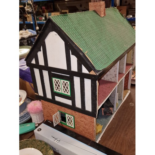 178 - Approximately 66.5 x 42.5 x 64.5 shed art dolls house, with minimal furniture and in need of TLC