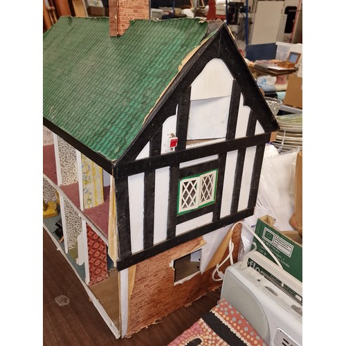 178 - Approximately 66.5 x 42.5 x 64.5 shed art dolls house, with minimal furniture and in need of TLC