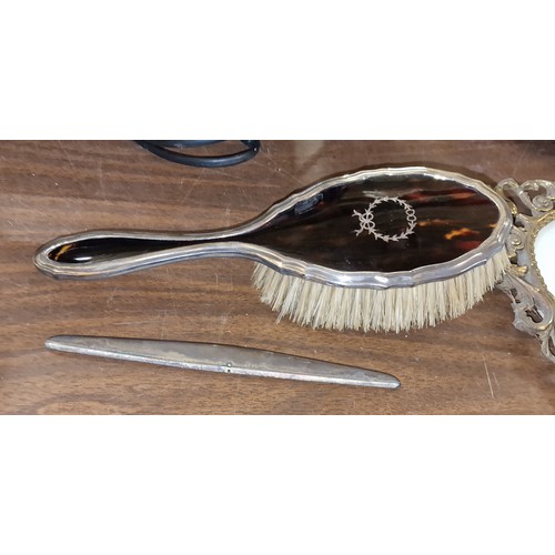 183 - Hallmarked silver and tortoiseshell dressing table brush and comb housing (no teeth)