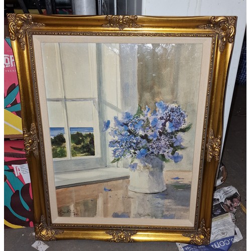 190 - 19x 23” ornate gilt framed tinted print after original Ray Ellis still life flowers by window painti... 