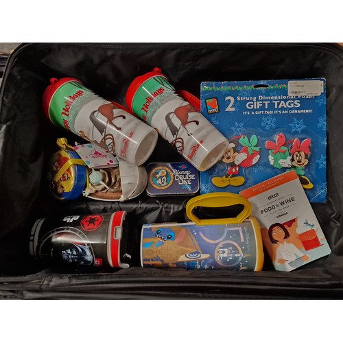 87 - Walt Disney world pull along hand luggage case with assorted Disney related items