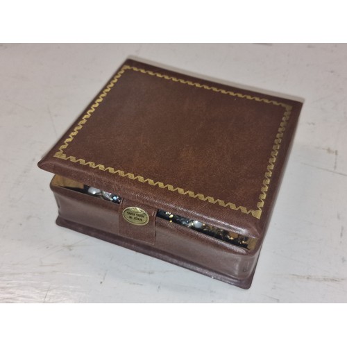 31 - Small faux leather bound jewellery box and contents