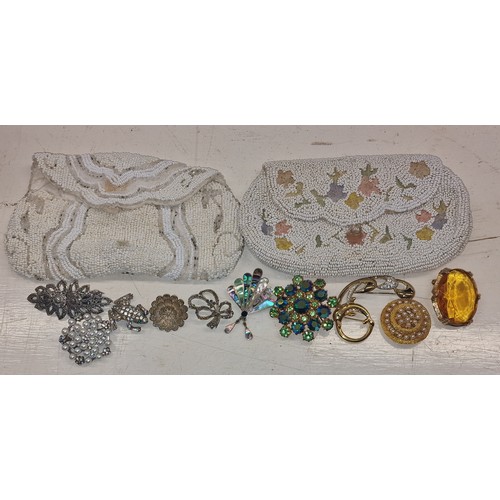 67 - 2 x vintage micro bead ladies clutch purses with assorted marcasite and other costume/dress brooches