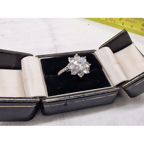 428 - 18 carat white gold ring with 1.67 ct moissanite central stone with other clear stone cluster size O... 