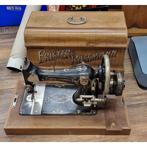 237 - Antique Frister & Rossmann hand crank sewing machine with wooden case (no key) - turns but stiff and... 