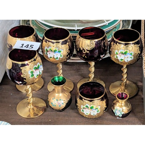 145 - Set of 5 x hand painted and gilt ruby glass goblets and 3 x miniature similar vases/pot