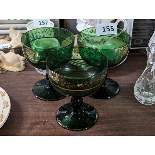 155 - Trio of green glass with gilt decoration liqueur glasses/champagne coupes