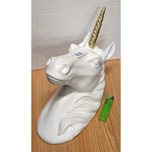 313 - Large white composite unicorn head with gold horn wall decoration