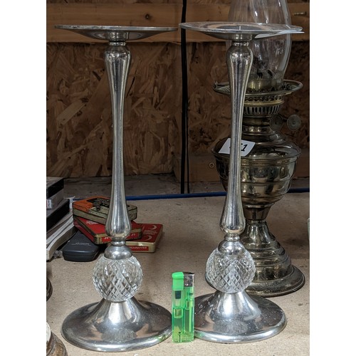 353 - Pair of chrome plated and glass candle stands