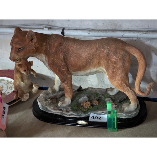 402 - Large Juliana collection lioness with cub figure on wooden base