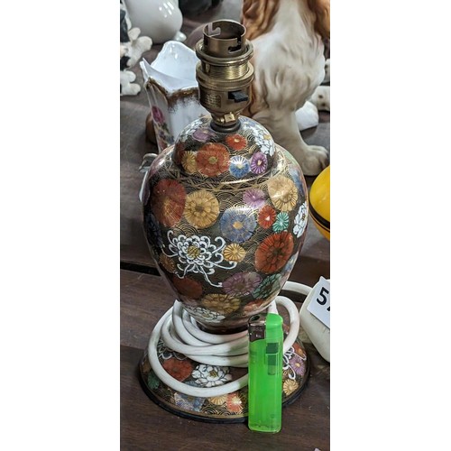 573 - Foreign stamped 24 cm tall Oriental influenced and hand painted table lamp