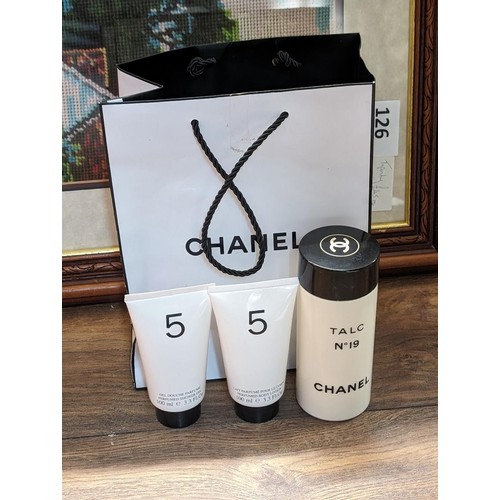 316 - Chanel bag containing talc no.19 and 5 perfumed shower gel and body lotion