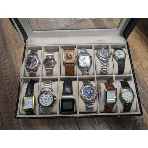 57 - 12 x assorted wrist watches in watch display case