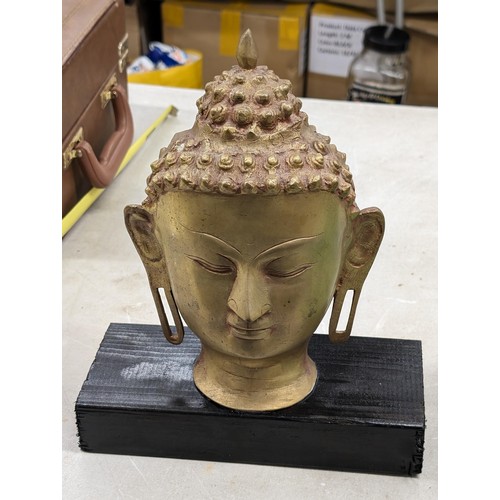 43 - 25 cm tall brass Thai Buddha head mounted onto wooden block