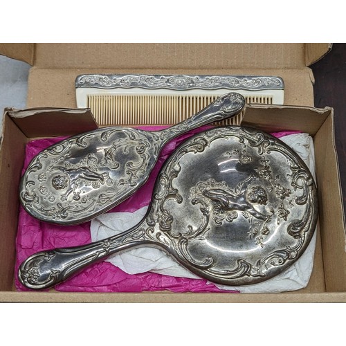 172 - 3-piece vintage heavy silver plated ladies vanity set with raised cherub patterning