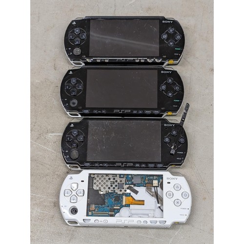 155 - 4 x assorted PSP hand held games consoles without chargers and offered as found for spare/repair