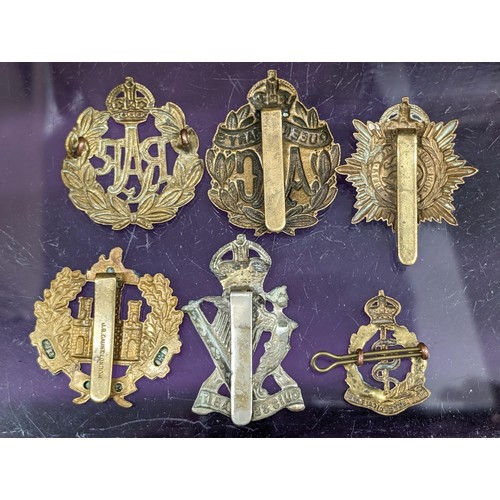 12 - Small collection of 6 x assorted military cap badges